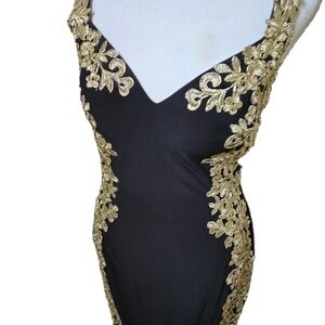 Sophisticated Black Dress with Gold Detailing